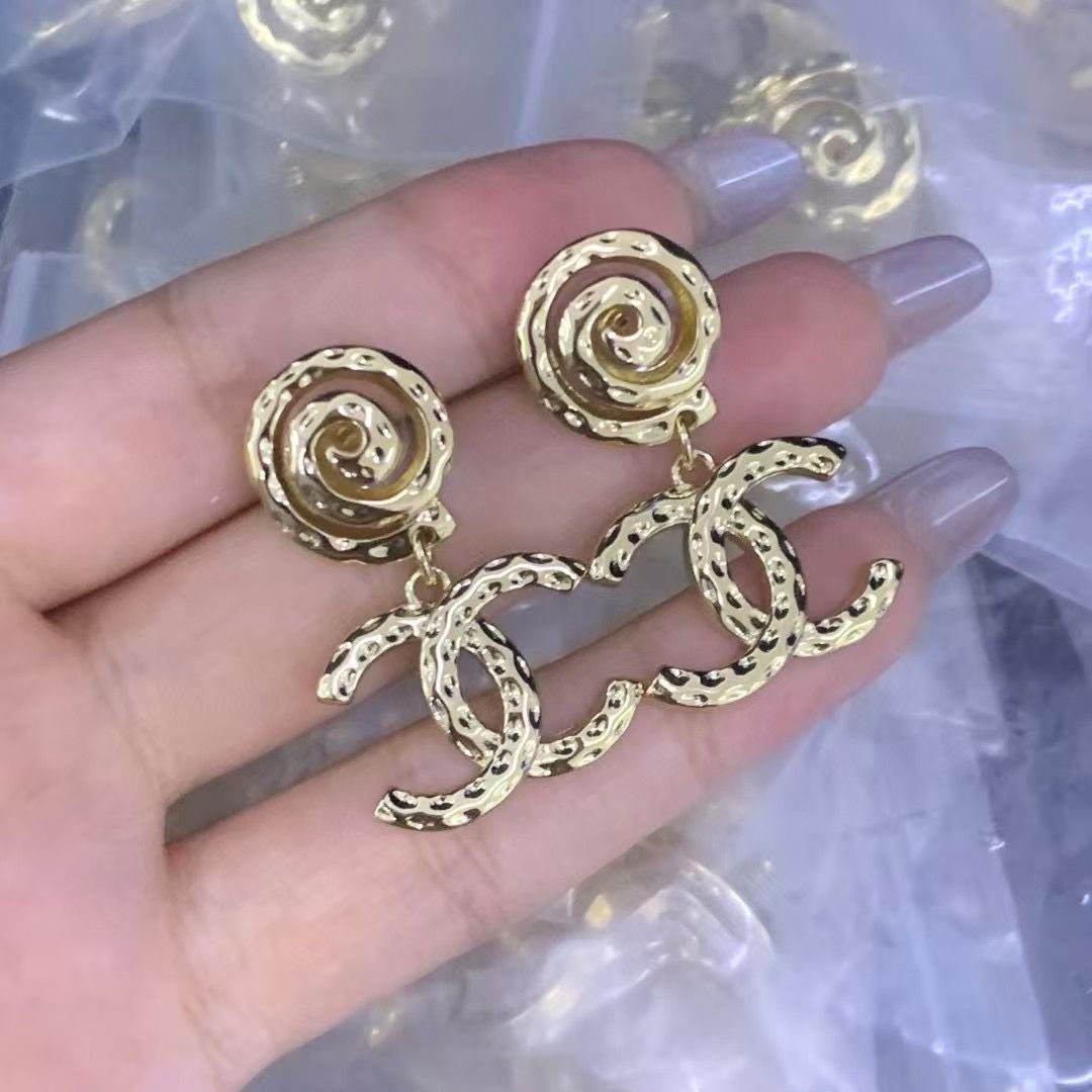 Chic Gold Tone Swirl Drop Earrings