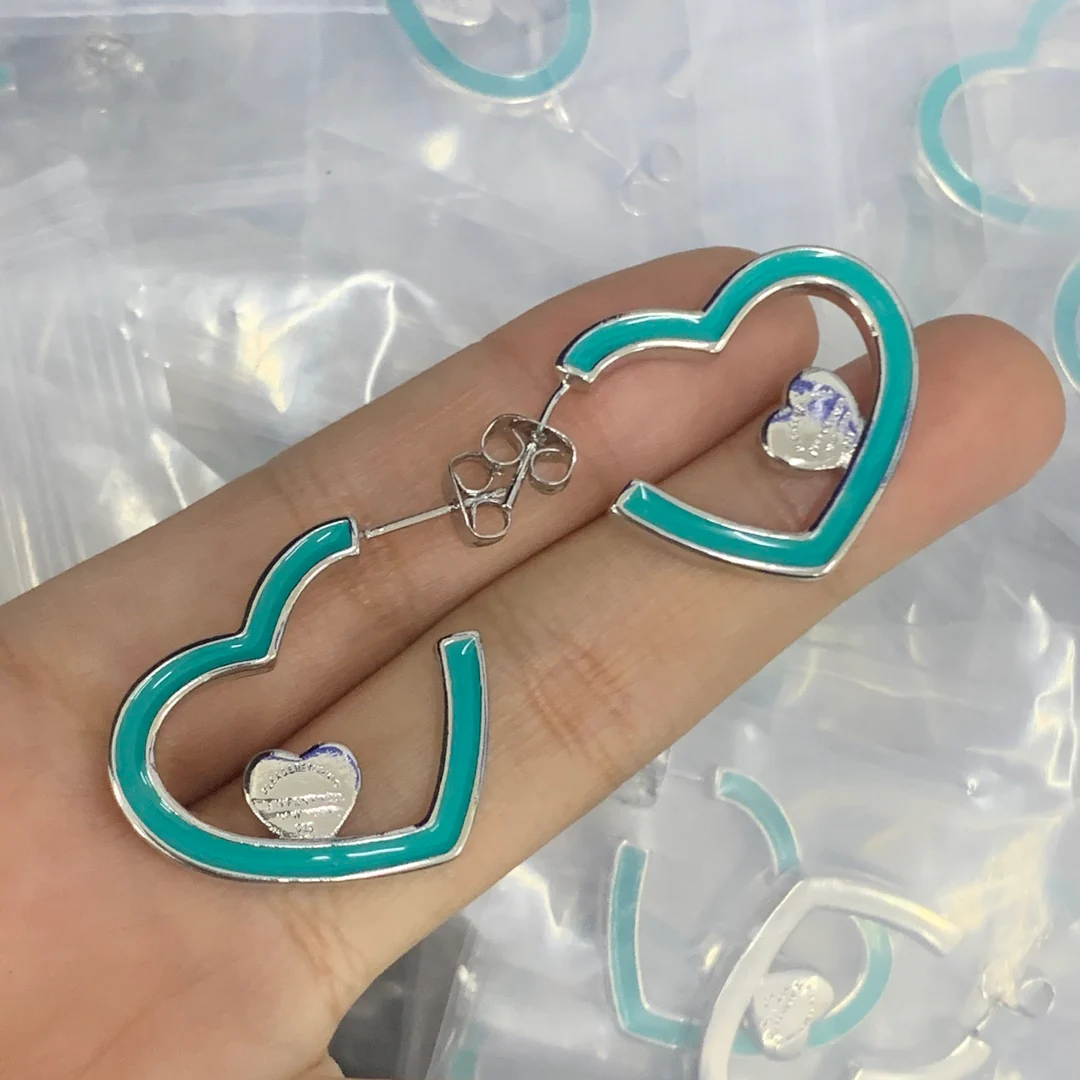 Stylish Silver Tone and Teal Enamel Heart Shaped Huggie Hoops