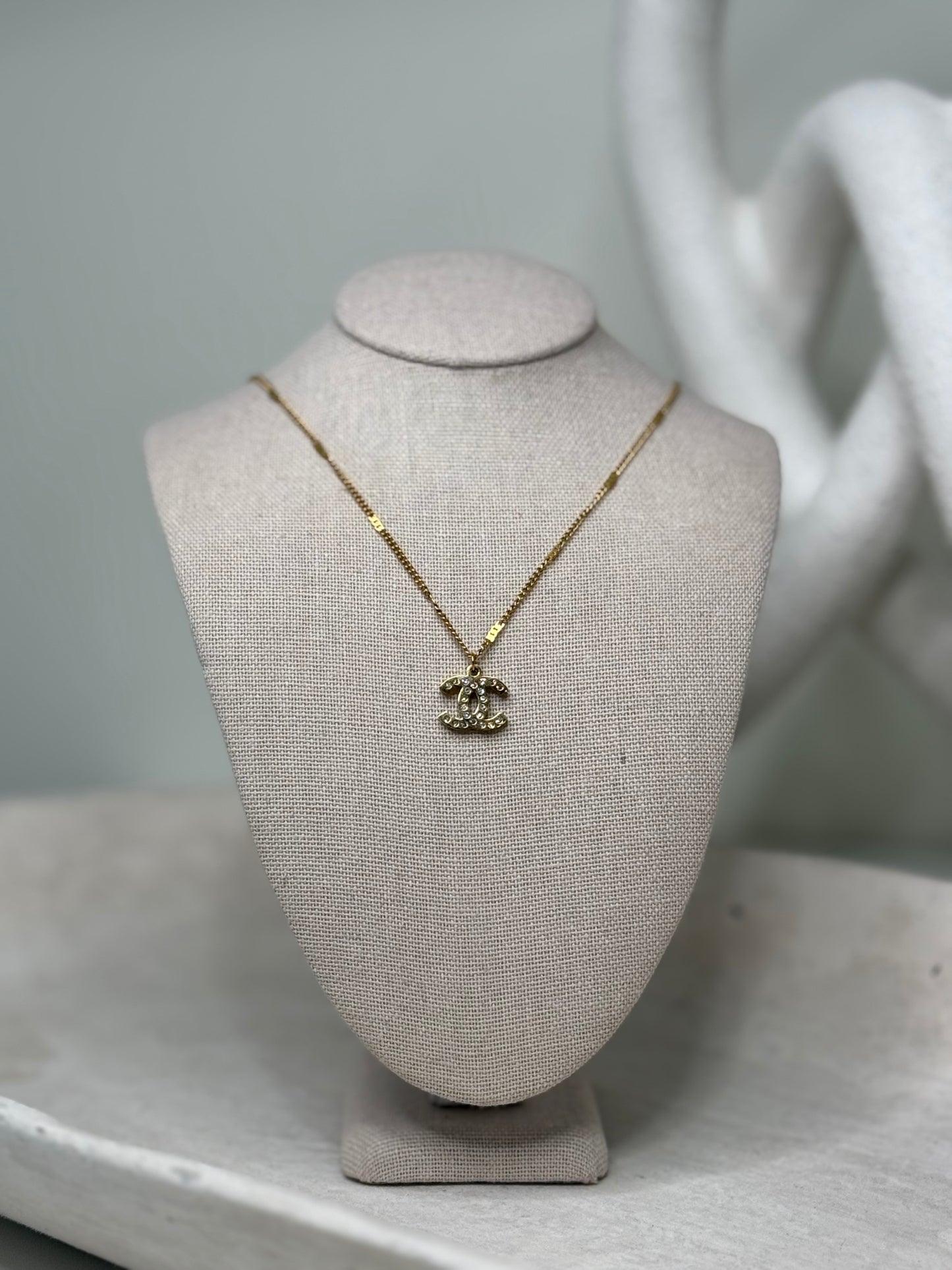 Intricately Designed 9"3/4" Necklace with Spaced Detailing and Small Charm