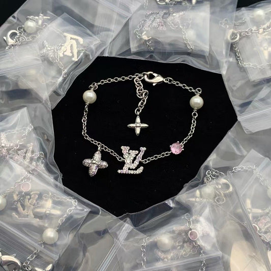 Sparkling Charm Bracelet with Faux Pearls and Pink Gem