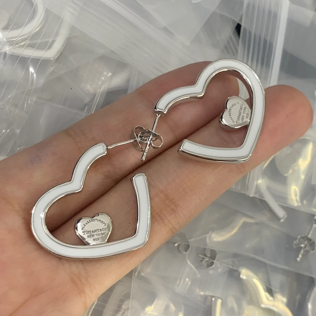 Stylish Silver Tone and Teal Enamel Heart Shaped Huggie Hoops
