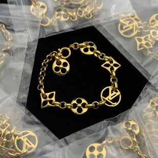 Luxury Link Bracelet with Distinctive Floral & Geometric Charms