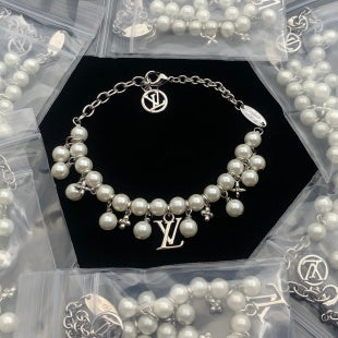 Dainty Pearl and Gold Charm Bracelet