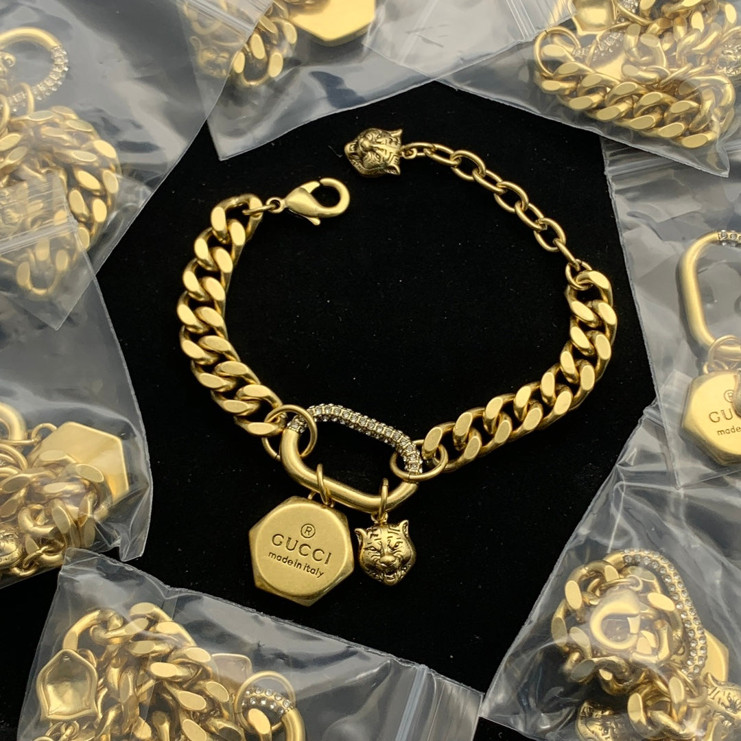 Luxurious Curb Chain Bracelet with Pave Detailing and Dual Animal Charms