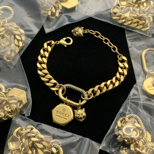 Luxurious Curb Chain Bracelet with Pave Detailing and Dual Animal Charms