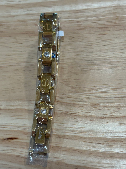 Signature Screw Motif Link Bracelet Elegant Gold Tone with Stone Detailin